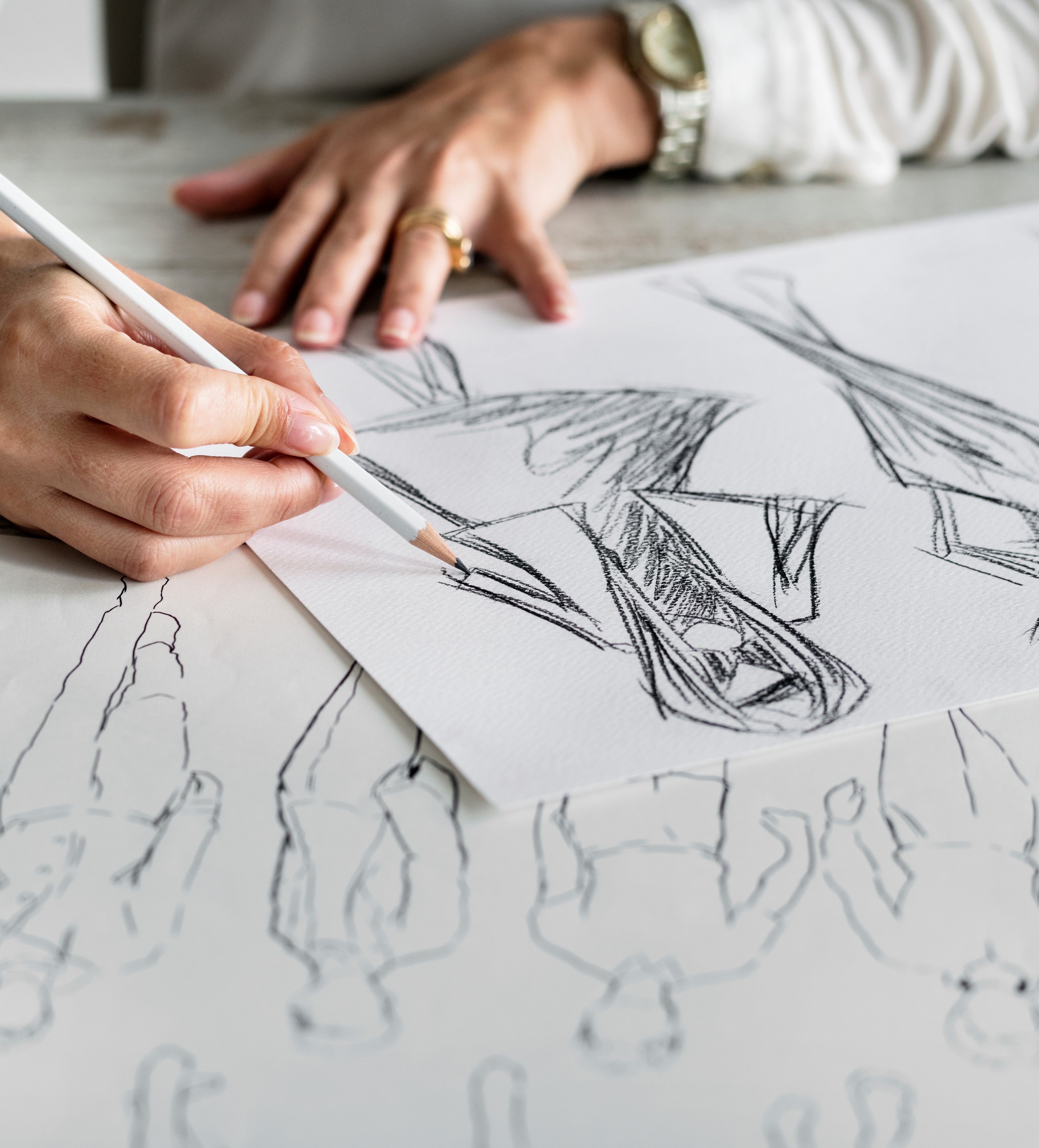 Fashion designer drawing on tablet