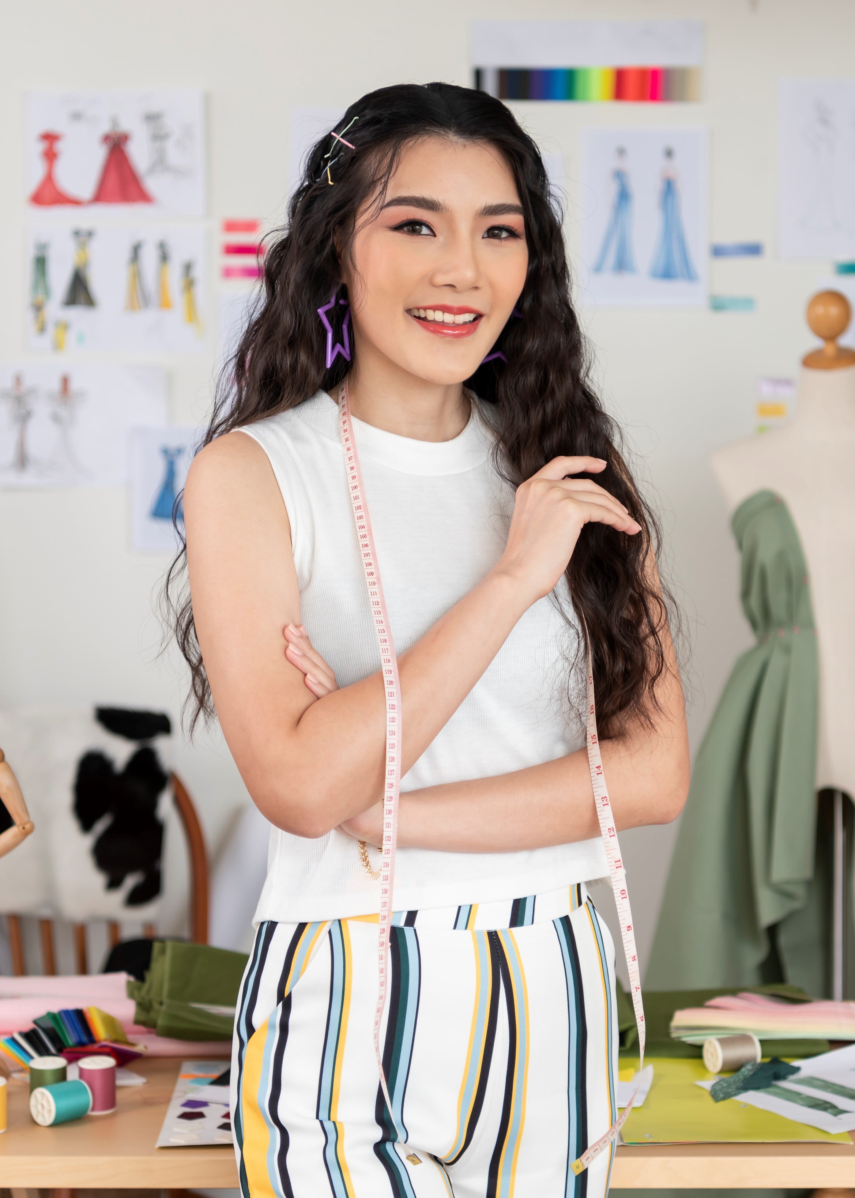 Fashion designer working with textile in workshop